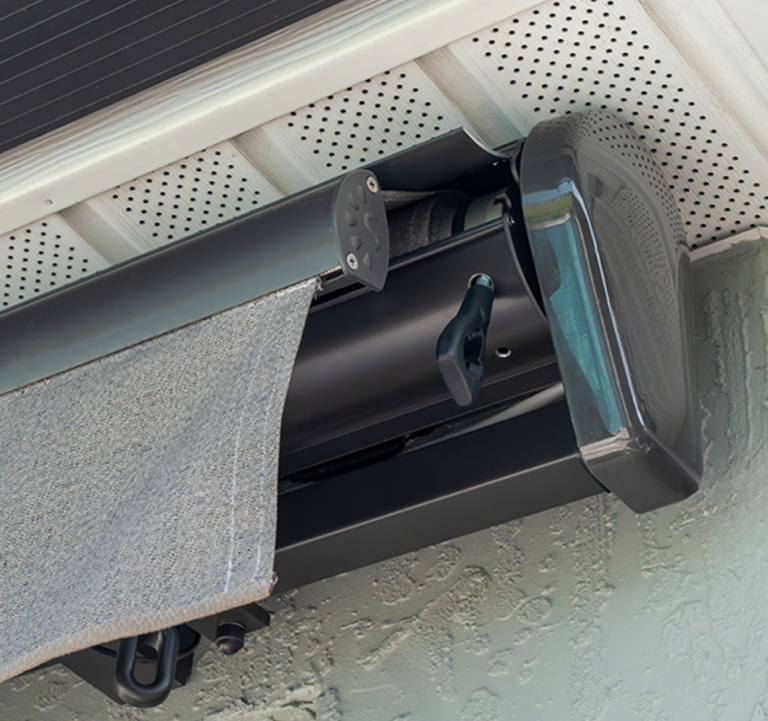 Outdoor retractable awning close-up under eaves.