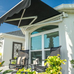 Sunny patio with chairs and awning