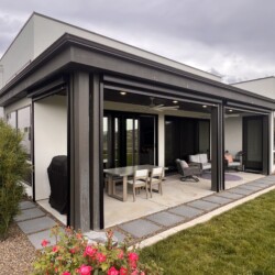 Modern patio with outdoor furniture and covered seating.
