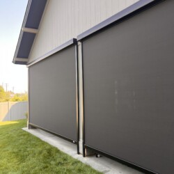 Modern outdoor window shades on house wall.