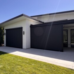 Modern house with black garage doors